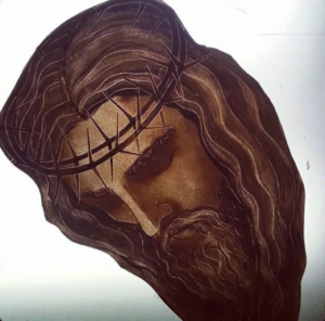 painted face on glass of Jesus