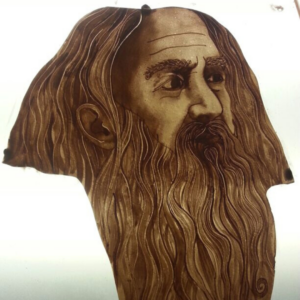 painted stained glass face, depicting Elija