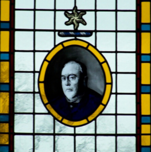 painted portrait in stained glass window