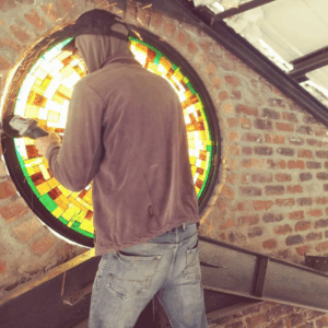 Installing the Big Round windows at Hey Joe's