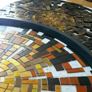 Cutting the glass for the big round windows at Hey Joe's